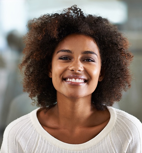 Patient in Hayward smiling after dental bridge placement 