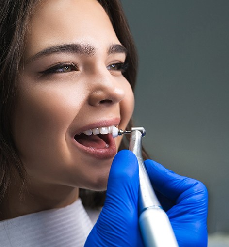 A woman getting a dental cleaning 